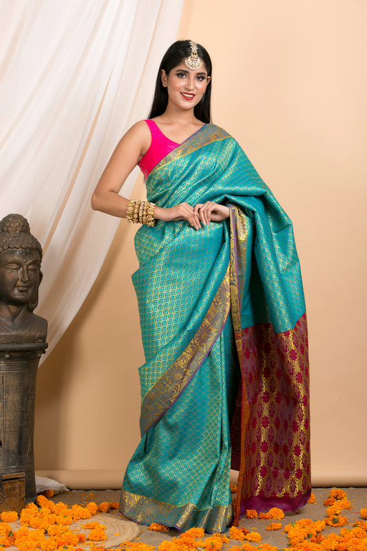 Blue Kanjivaram saree with Gold Floral zari Border and red palla