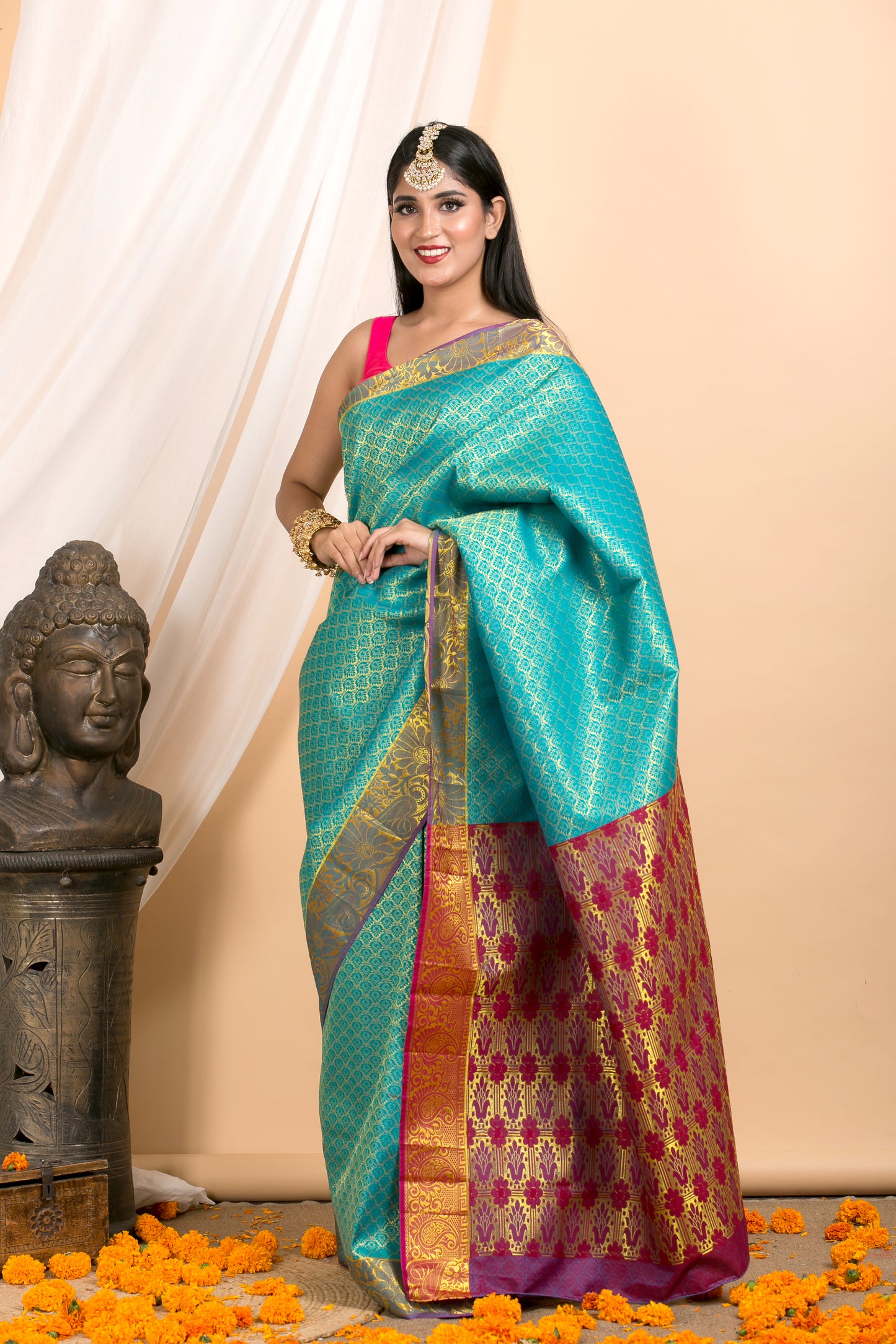 Blue Kanjivaram saree with Gold Floral zari Border and red palla