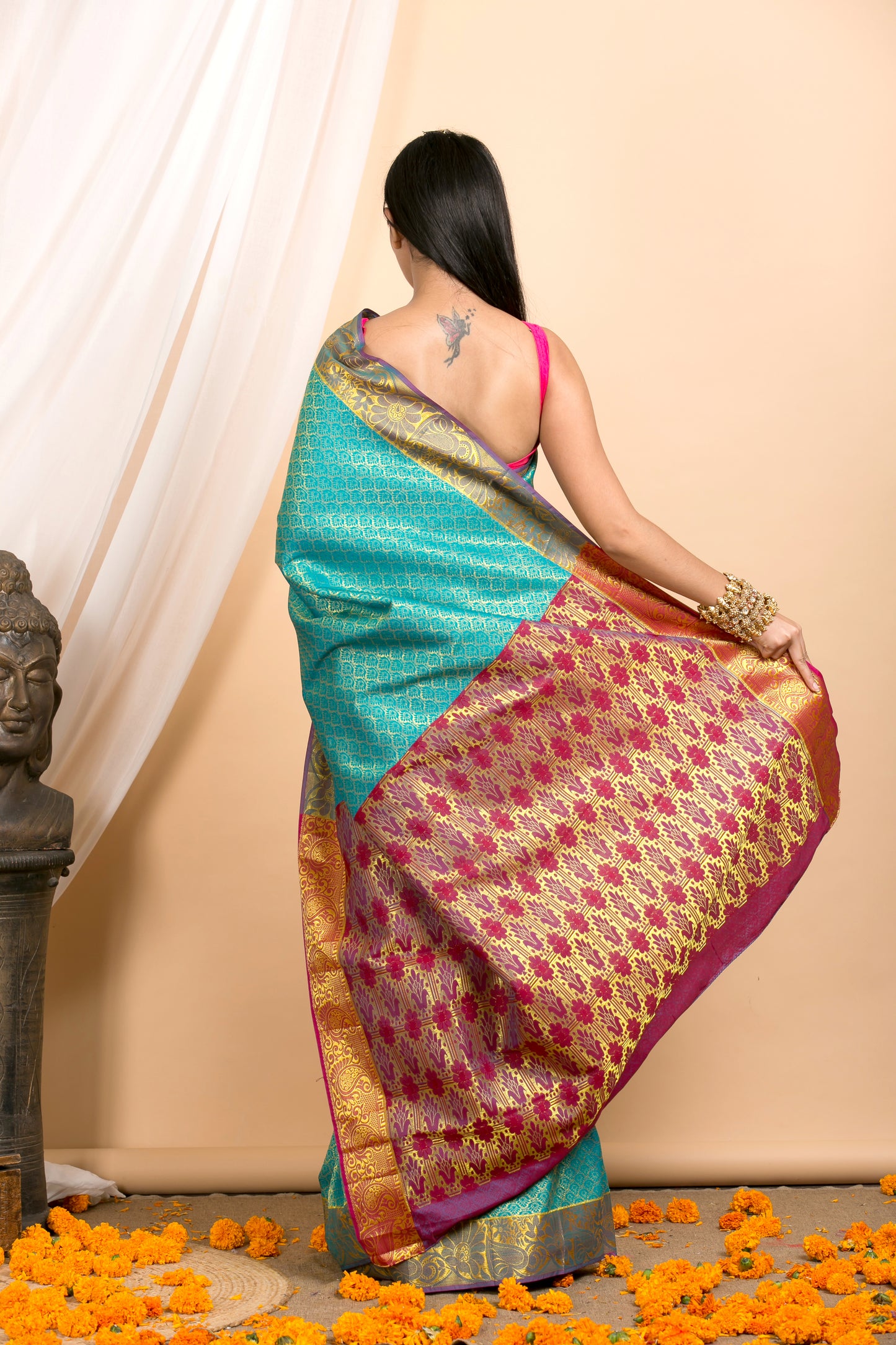 Blue Kanjivaram saree with Gold Floral zari Border and red palla