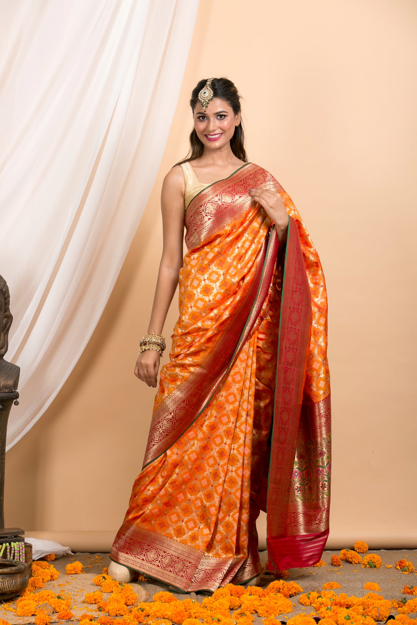 Orange Banarasi Patola pattern saree with Red Border