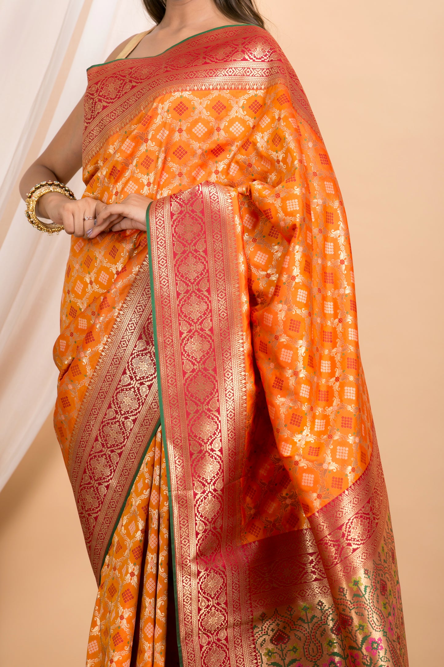 Orange Banarasi Patola pattern saree with Red Border